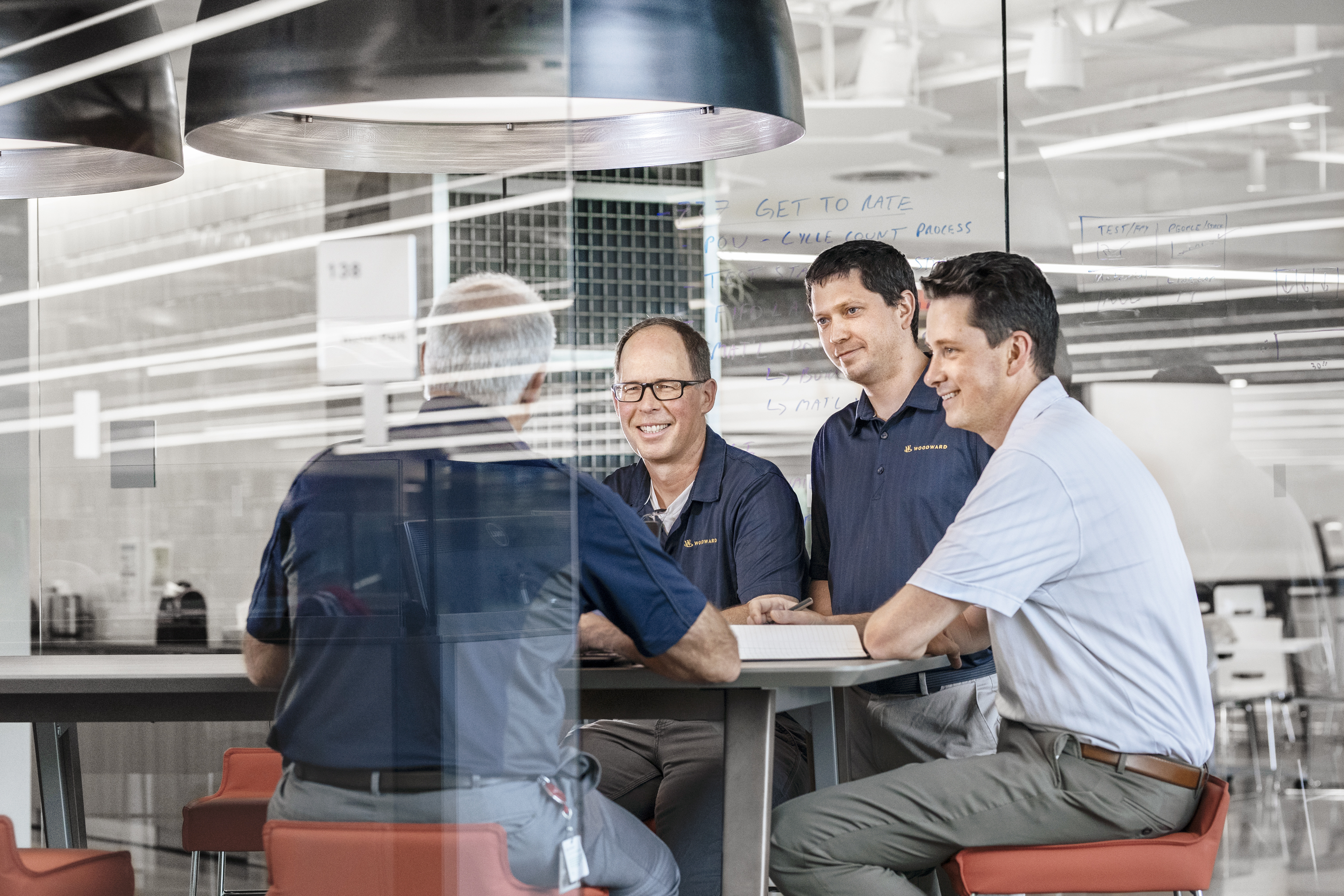 males professionals smiling and talking